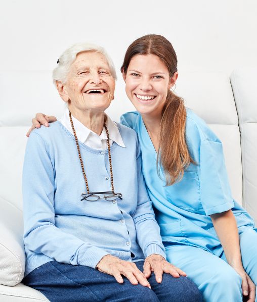 Nursing Assistance and Laughing Happy Senior Citizen